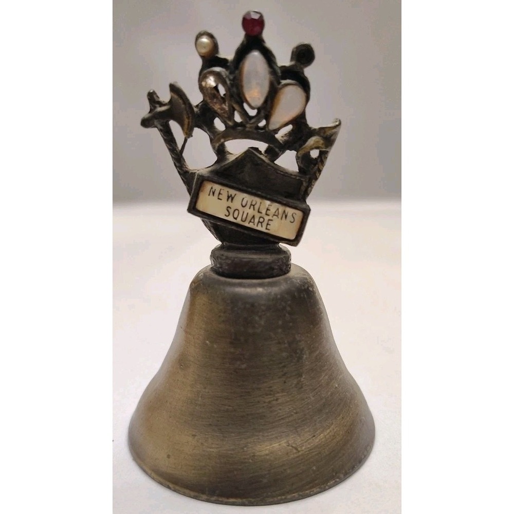 New Orleans Square Souvenir Mementos Brass Cow Bell Embellished Crown Axe Sword